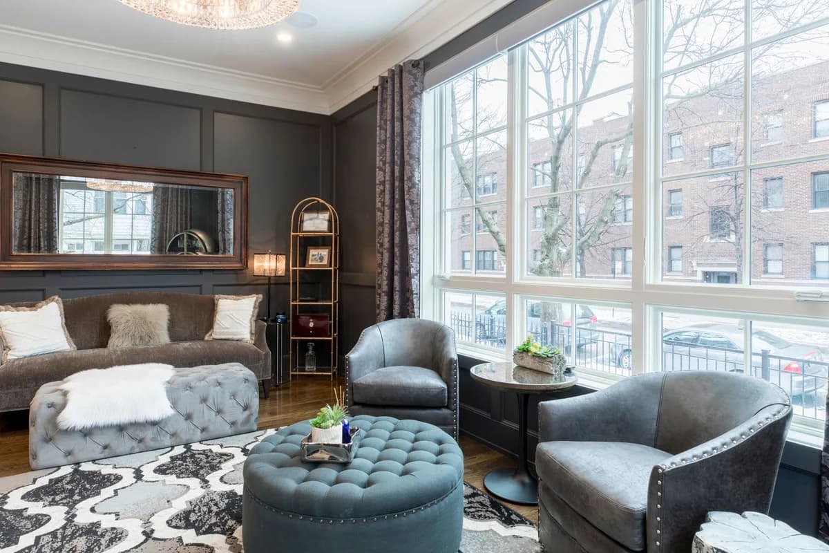 A light-filled bedroom and sitting area; illustrative stock photography, not a Broom Home listing.